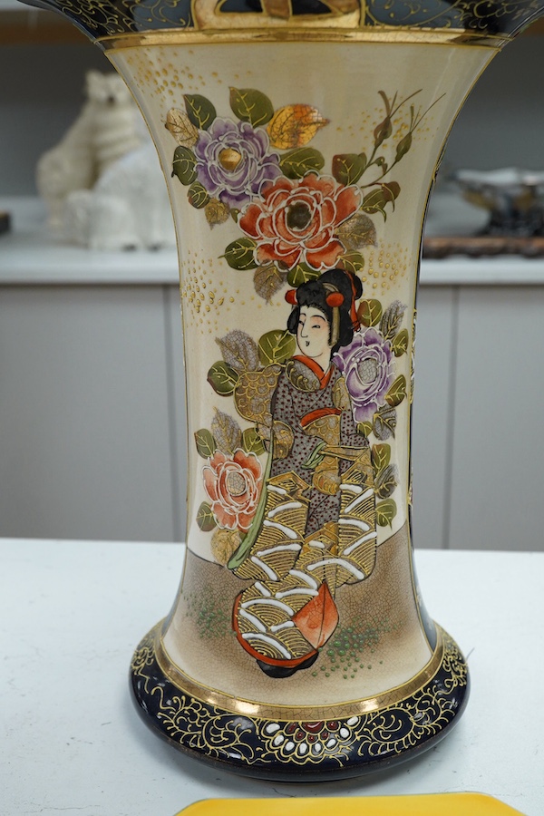 A 20th century Japanese Satsuma pottery trumpet vase decorated with figures, 32cm high. Condition - crazed